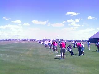 Golfers warm up on the range